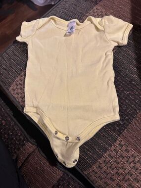 American Apparel Pale Yellow Baby Bodysuit